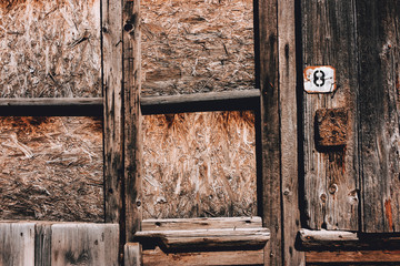 Old dark brown grunge wooden background.