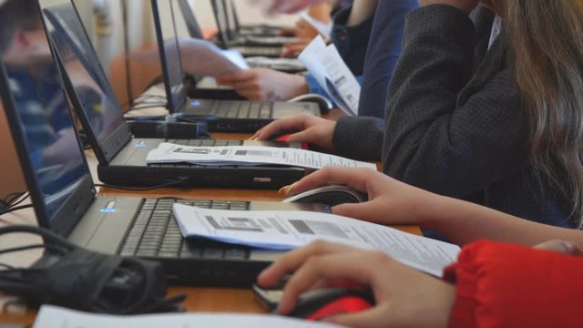 Students in front of computers in a computer class.