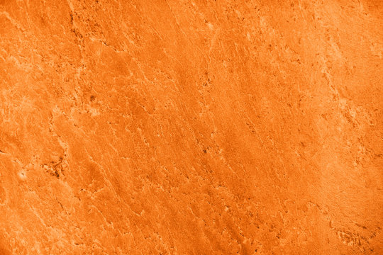 Close up of abstract turmeric orange toned granite stone texture with high resolution. For background, textures, product designs, albums, cards and invitations, catalogs