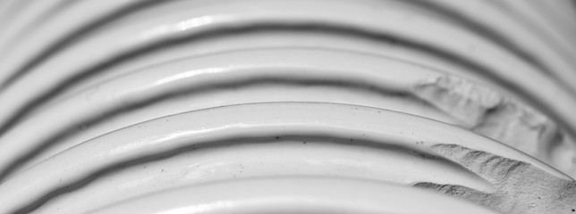 Ceramic insulator with high voltage. Dangerous industrial facility. Close up, macro photo.