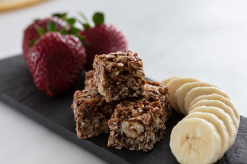 granola bar with banana and strawberry top view 