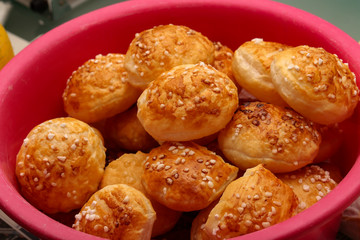 Freshly baked ruddy buns cool on the table