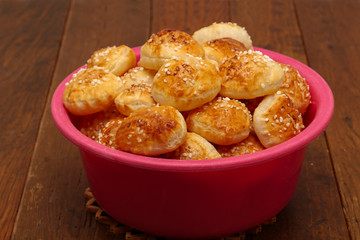 Freshly baked ruddy buns cool on the table