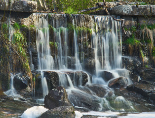 Old dam and waterfall in spring time