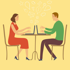 Boy and girl sitting in cafe and using internet with laptop