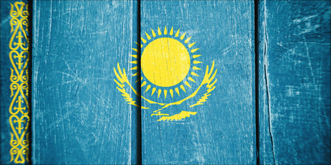 Flag of Kazakhstan, wooden background.