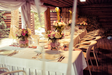  Wedding decorations. Rings on textiles, decorations with fresh flowers, candles, catering in purple tone. Stylish holiday atmosphere