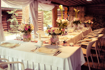  Wedding decorations. Rings on textiles, decorations with fresh flowers, candles, catering in purple tone. Stylish holiday atmosphere