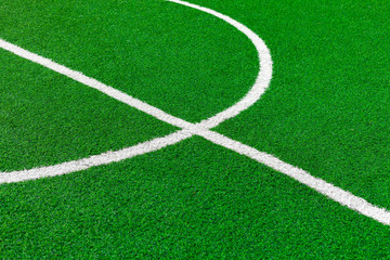 Painted White Lines And Fragment Of Circle On Green Artificial Turf On Soccer Field. Center Of Football Fiels.