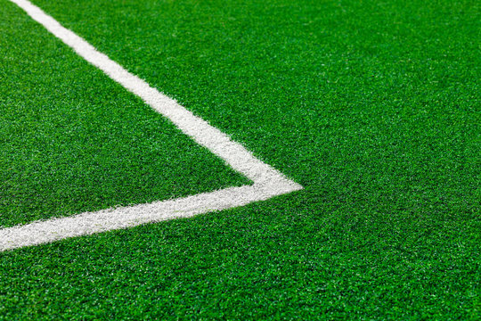 Painted White Lines Of Green Artificial Turf On Soccer Field.