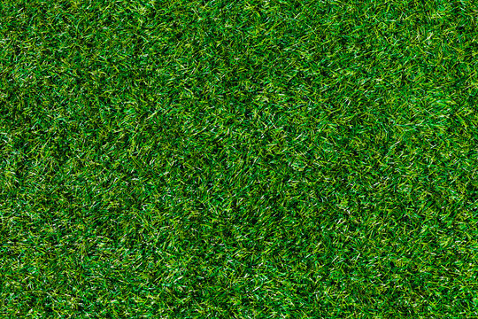 Top View Green Grass, Artificial Soccer Coverage, Field Or Lawn. Fake Grass Background For Playgrounds And Decoration.