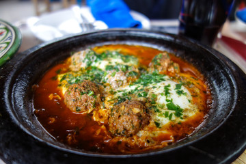 kofta tajine, kefta tagine, moroccan cuisine, lamb meatballs with eggs served in a restaurant in...