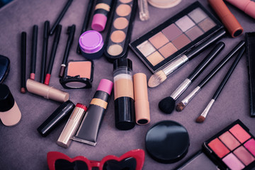 Close up of cosmetics variety lying on the table in the room