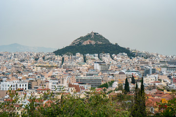 Fototapeta na wymiar View from Acropolis on cityscape of Athens and Lycabettus Hill, known as Lykabettos