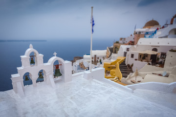 Tilt shift effect of orthodox church white roof with bells