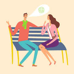 Pair sitting on a bench and laughing