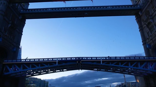 River bus boat passes Tower Bridge in river Thames