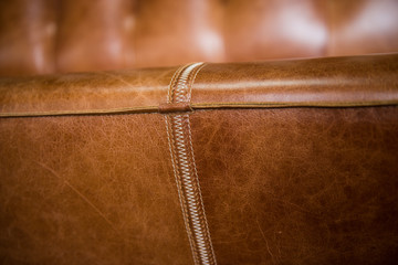 Seams on leather furniture. Leather close-up.