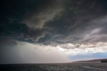 Fototapeta na wymiar Dramatic Afternoon Storm over the Ocean 