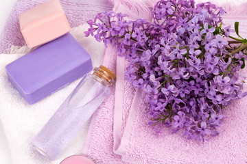 Lilac flower soap and essential oil, spa concept.