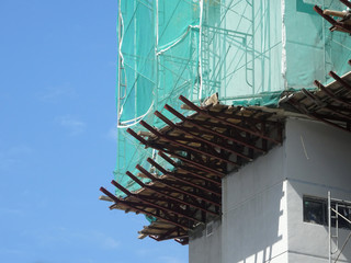Catch platform and safety netting at the face of the building during high-rise building construction. It protects individuals and property from falling debris. 