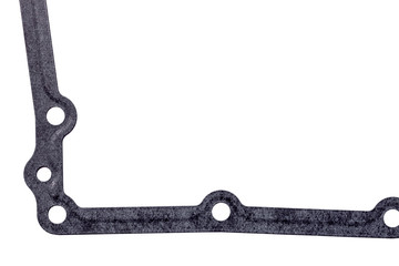 Seal gasket for gearbox pallet with hole, replaceable car part close up on white background.