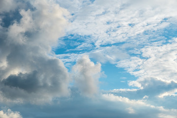 Naklejka na ściany i meble Dramatic clouds on the vast blue sky