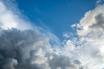 Fototapeta na wymiar Dramatic clouds on the vast blue sky