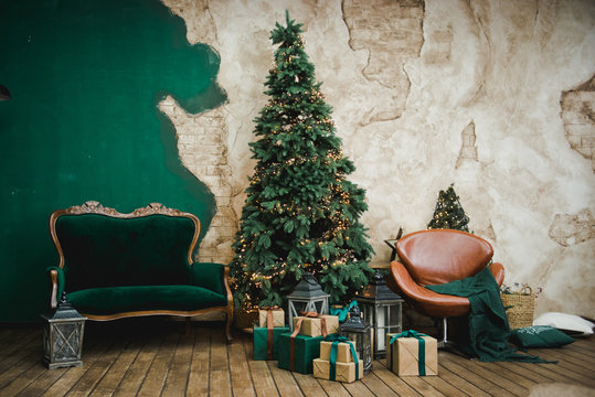 Living Room In Retro Style With A Christmas Decor. Christmas Living Room With Sofa, Christmas Tree And Gifts. New Year Home Interior Background. Green, Brown, Golden Color.