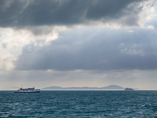 Ferry and Hills on the horizon next to the island of Koh Phangan.Thailand.
