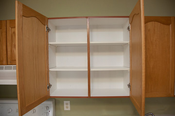 Two open kitchen cupboards