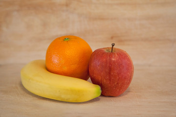 Healthy fruits on wood background
