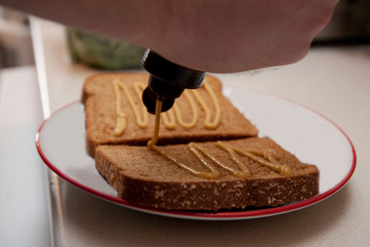 Bread With Mustard On A Plate