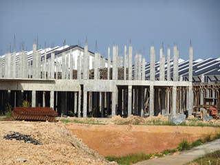 Naklejka premium Double story luxury terrace house under construction in Malaysia. Designed by an architect with a modern and contemporary style. 