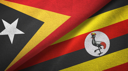Fototapeta premium East Timor and Uganda two flags textile cloth, fabric texture