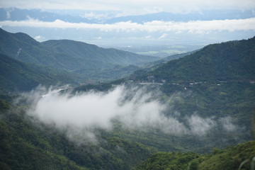 Aerial view of the morning foggy landscape in the mountains. The morning view on the hilltop.