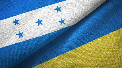 Honduras and Ukraine two flags textile cloth, fabric texture