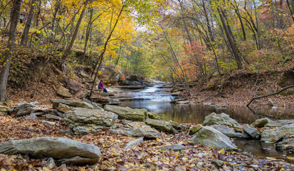 Tourists sitting on bench at Tanyard Creek Nature Trail Bella Vista, Northwest Arkansas