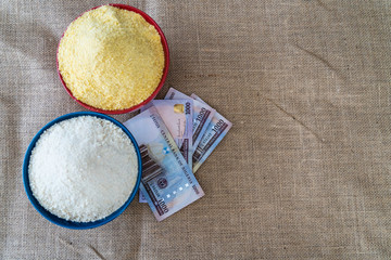 Nigerian yellow and white Garri in Bowls at marketplace