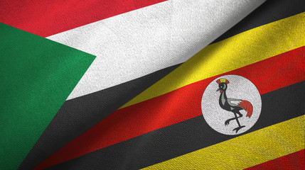 Fototapeta premium Sudan and Uganda two flags textile cloth, fabric texture