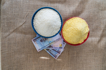 Nigerian yellow and white Garri in Bowls at marketplace