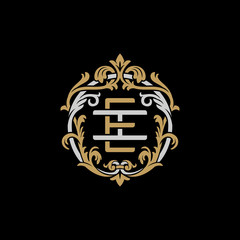 Initial letter I and E, IE, EI, decorative ornament emblem badge, overlapping monogram logo, elegant luxury silver gold color on black background