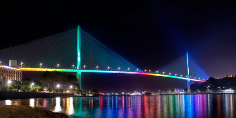 Bai Chay bridge night lights shimmering two peninsula connected Hon Gai and Bai Chay in Ha Long city, Quang Ninh province, Vietnam