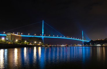 Fototapeta premium Bai Chay bridge night lights shimmering two peninsula connected Hon Gai and Bai Chay in Ha Long city, Quang Ninh province, Vietnam