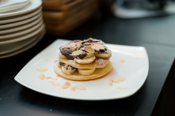 two waffles and banana with chocolate sauce 