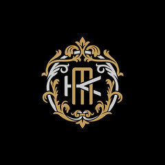 Initial letter K and M, KM, MK, decorative ornament emblem badge, overlapping monogram logo, elegant luxury silver gold color on black background