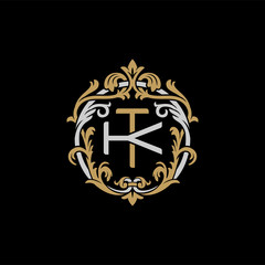Initial letter K and T, KT, TK, decorative ornament emblem badge, overlapping monogram logo, elegant luxury silver gold color on black background