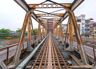 Vintage railroad tracks leading over the famous Long Bien Bridge, Hanoi, Vietnam. This is the railway line was built so long and still in operation today