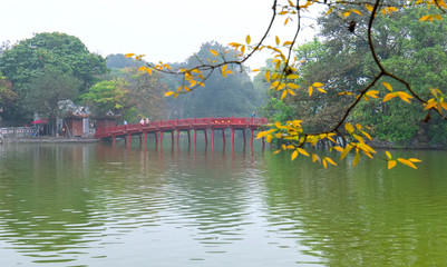 Architectural Huc Bridge looming shake trees lake with arched red crawfish culture symbolizes...