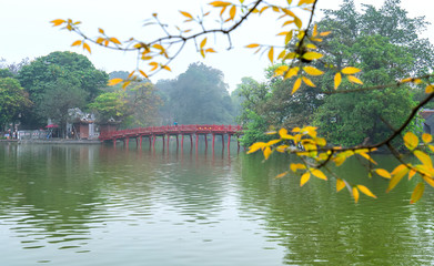 Architectural Huc Bridge looming shake trees lake with arched red crawfish culture symbolizes...
